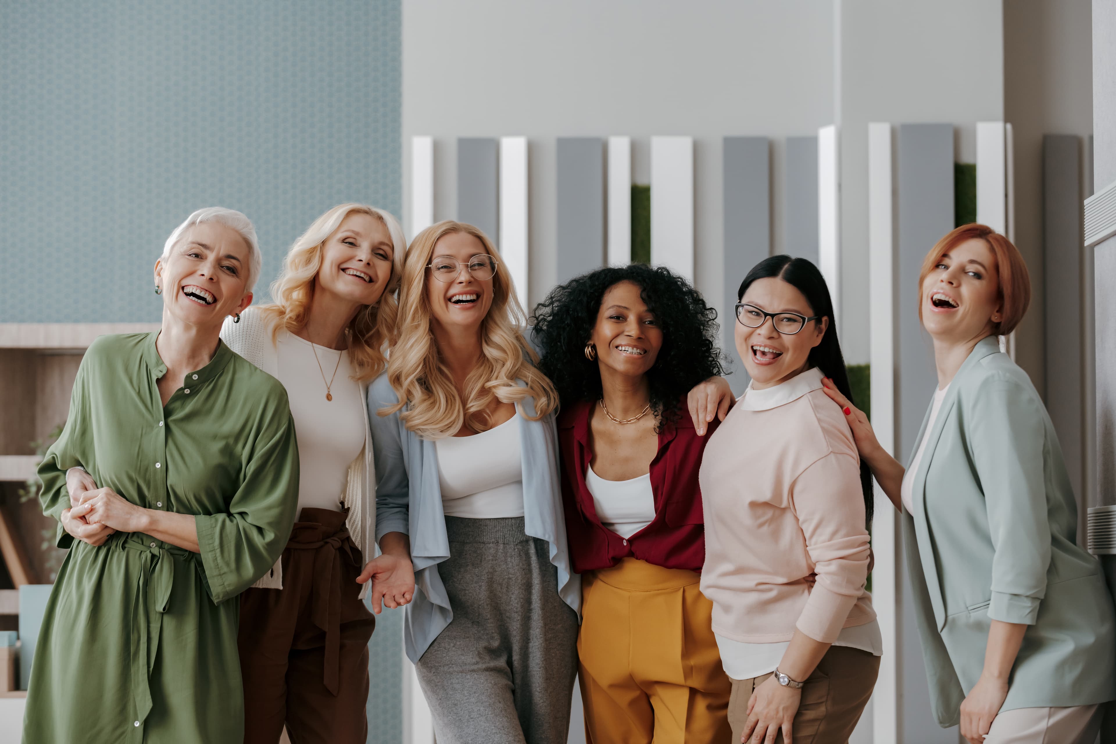 A small group of women laughing together